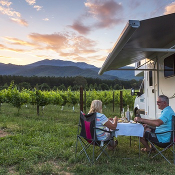 AU_NZ_Maui Winery Haven_Exterior Picnic Awning Sunset Vines Food Wine.jpg