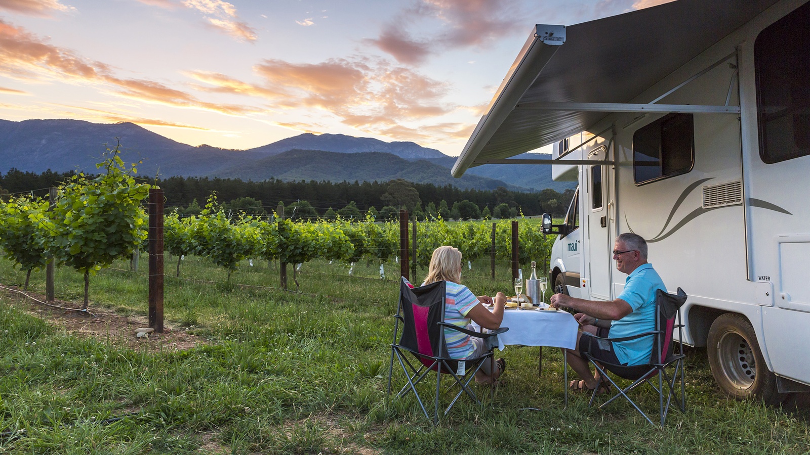 AU_NZ_Maui Winery Haven_Exterior Picnic Awning Sunset Vines Food Wine.jpg