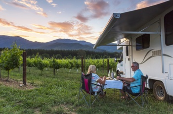 AU_NZ_Maui Winery Haven_Exterior Picnic Awning Sunset Vines Food Wine.jpg